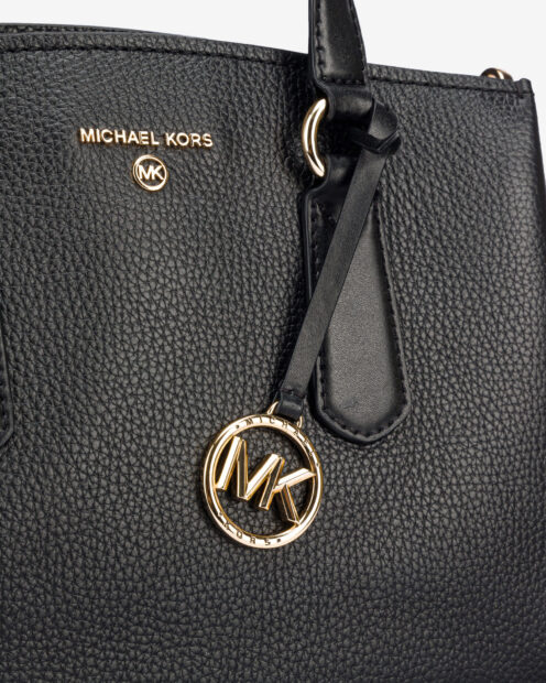 Close up of Michael Kors logo on black leather handbag accessory