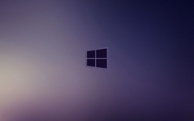 A dark purple abstract background featuring the Microsoft logo in the center