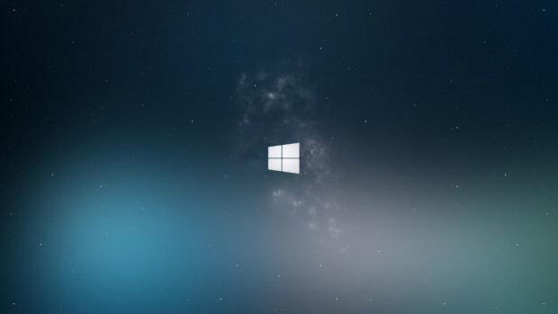 White Microsoft logo in galaxy space background with stars and nebula