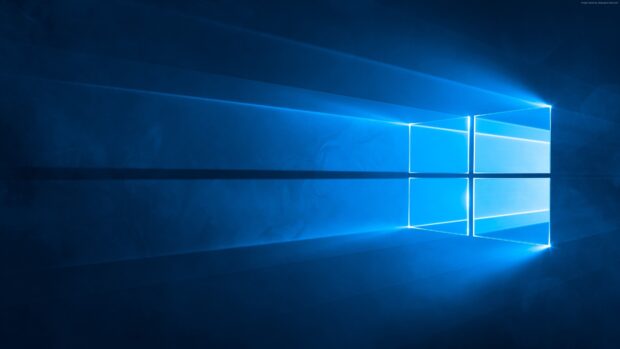 Blue light rays forming a Microsoft window on a dark background with light beams spreading out