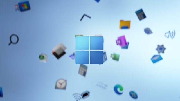Blue Microsoft icon with floating app icons on a blurred background