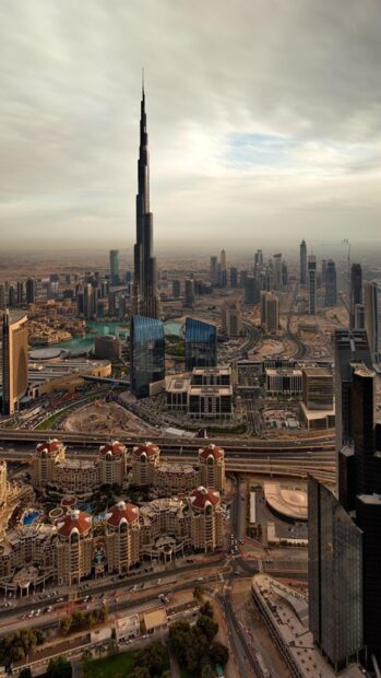 The cityscape of Middle East featuring modern skyscrapers and desert terrain