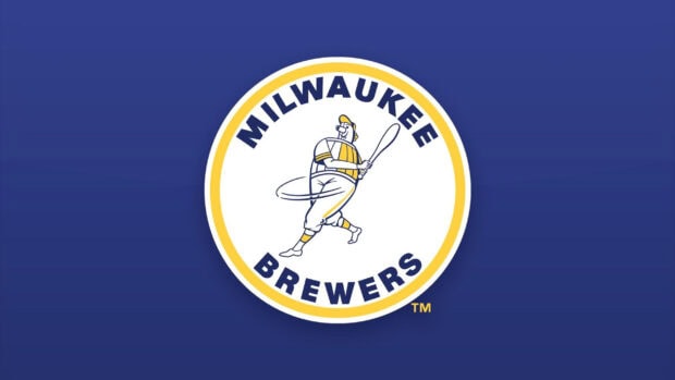 Milwaukee Brewers logo with a vintage baseball player swinging a bat on a blue background