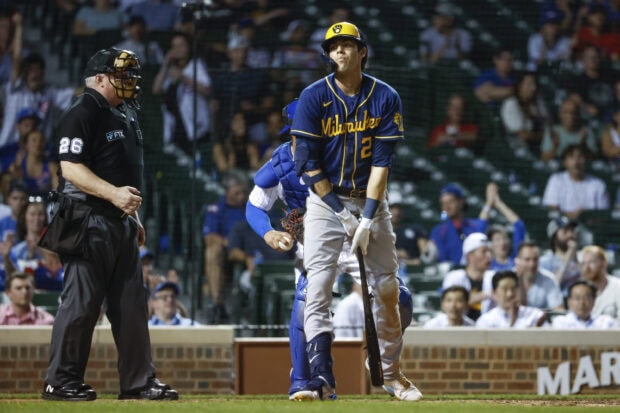 Milwaukee Brewers player number 2 standing at home plate during a baseball game