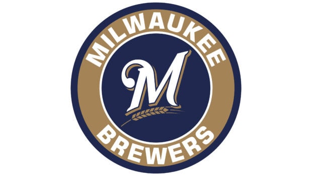 Milwaukee Brewers logo with a large white M and golden wheat on a navy blue circle background