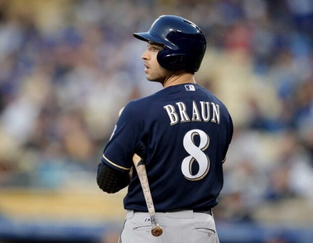 Christian Braun player of Milwaukee Brewers standing with bat on the field