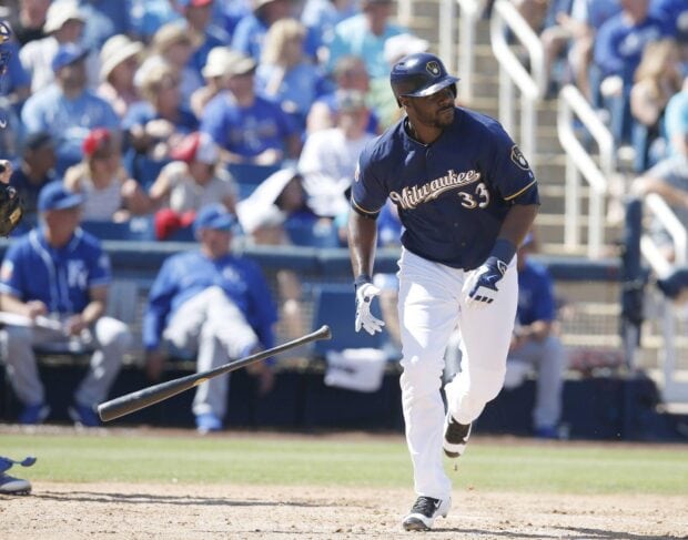 Milwaukee Brewers player running after hitting the ball during a game