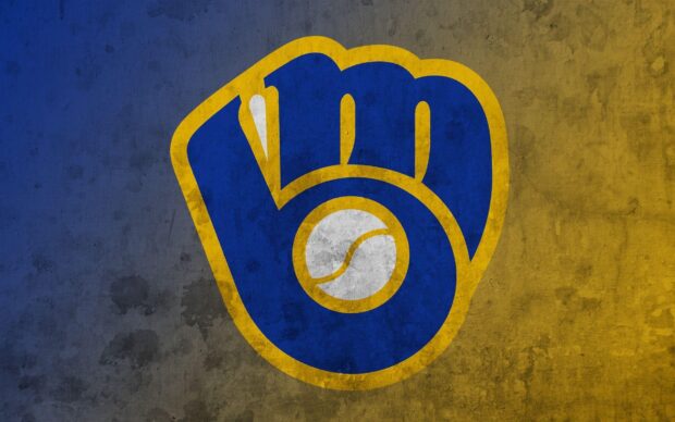 Milwaukee Brewers logo painted on a textured wall showing the baseball glove design