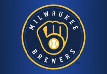 Milwaukee Brewers logo with a baseball glove and ball on a blue background