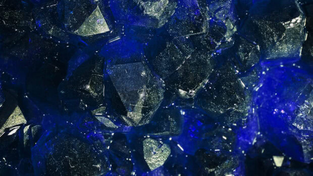 Close up view of minerals with deep blue and metallic colors shining brightly