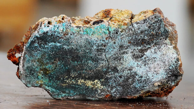 A close up view of minerals with textured surfaces and blue green hues