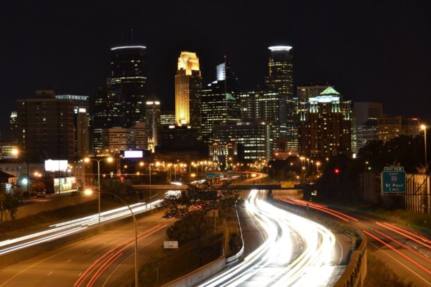 Night view of Minneapolis downtown with highway light trails