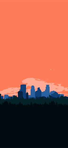Blue Minneapolis city skyline silhouette over orange sky with forest foreground at sunset