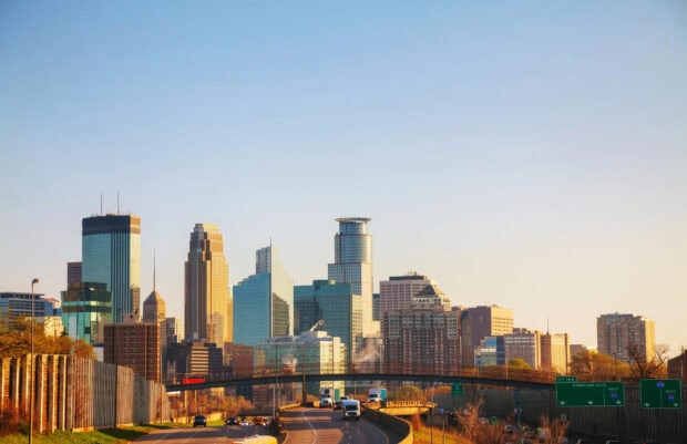 Minneapolis city skyline with skyscrapers and highway captured in the morning light