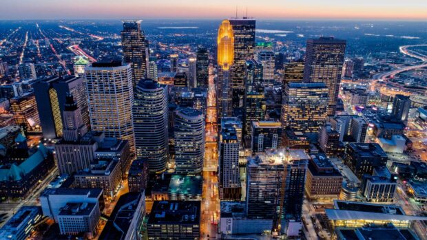 Minneapolis skyline with illuminated buildings at dusk in the city center