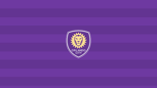 Orlando City logo with a lion symbol on a purple striped background