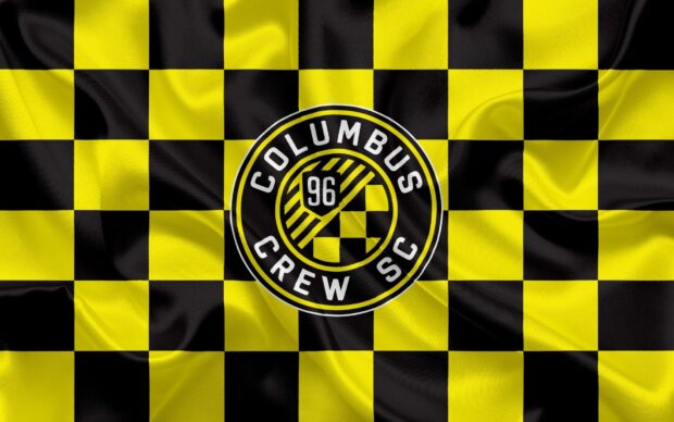Columbus Crew SC logo with black and yellow checkered pattern flag design