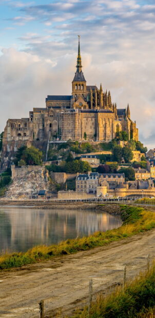 Mont Saint Michel medieval abbey rising above tidal waters and historic village