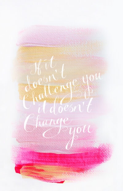 Soft pastel brushstrokes with an inspiring challenge quote on canvas texture