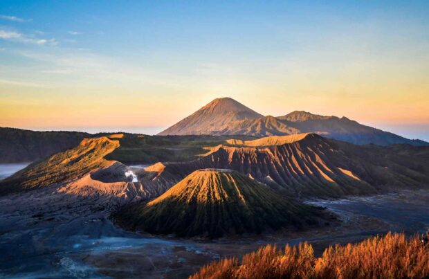The view of Mount Bromo during sunrise with stunning volcanic landscape