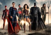 The Justice League superheroes standing together in a dramatic scene