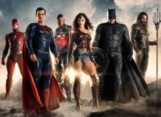 The Justice League superheroes standing together in a dramatic scene