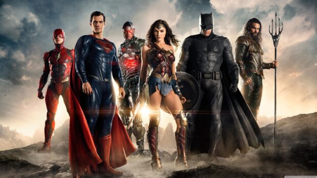 The Justice League superheroes standing together in a dramatic scene