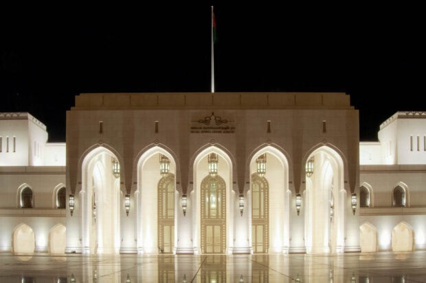 The Royal Opera House illuminated at night in Muscat Oman