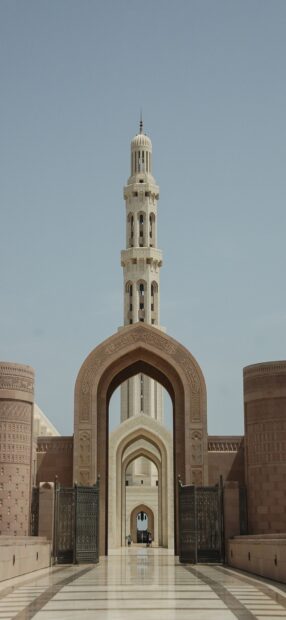 The intricate Islamic architecture of the mosque arches in Muscat Oman