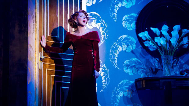 A performer expressing emotion during a musical on stage