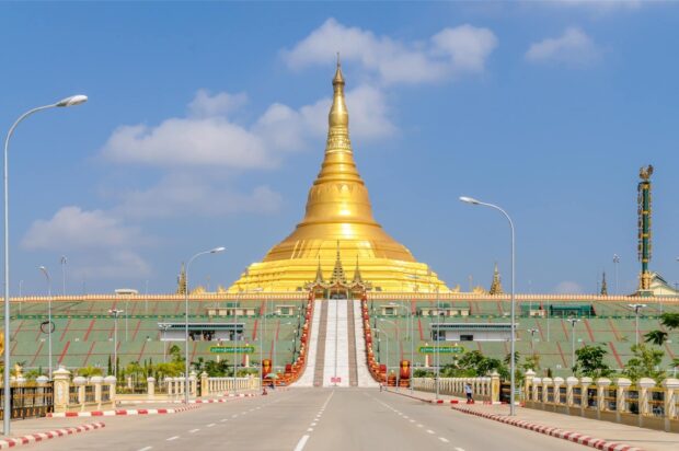 The golden stupa of Myanmar prominent under a clear blue sky