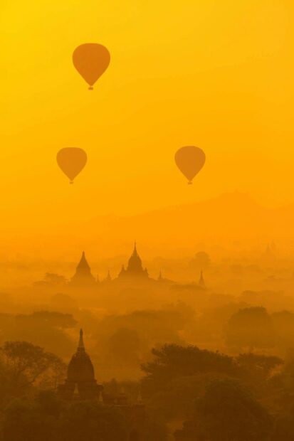 Myanmar Wallpaper HD Mobile Hot air balloons floating over ancient Myanmar temples at sunrise in a golden mist