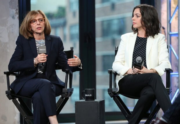 Two women having a conversation on a panel discussion about Nancy Meyers