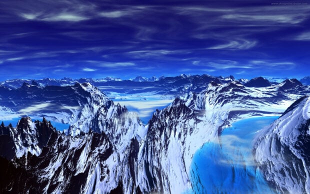 Snow covered mountains with clear blue sky in a National Geographic landscape