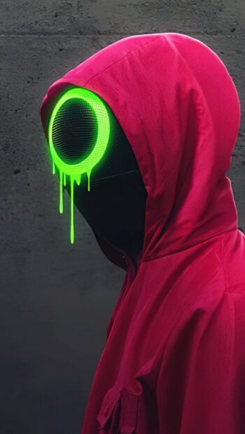 Character from Netflix wearing pink hood with glowing green eye mask