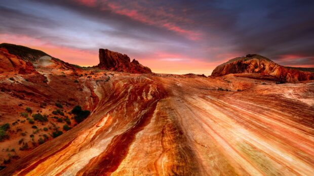 Red rock formations and vibrant desert landscape at sunset in Nevada
