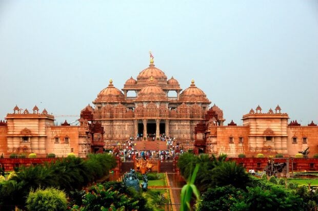 The Akshardham temple in New Delhi with intricate architecture and lush gardens in front