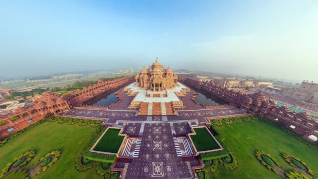 Aerial view of New Delhi temple with symmetrical gardens and pathways in 4K quality