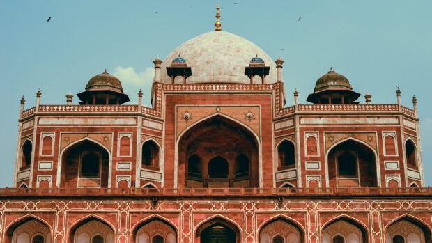 The historical monument in New Delhi featuring intricate red sandstone architecture