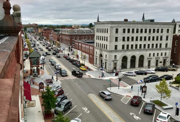 Historic downtown street with New Hampshire buildings and traffic in an urban scene