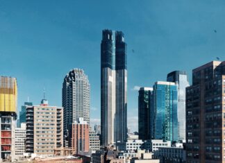 Modern architecture and tall buildings in New Jersey cityscape under clear blue sky