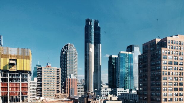 Modern architecture and tall buildings in New Jersey cityscape under clear blue sky