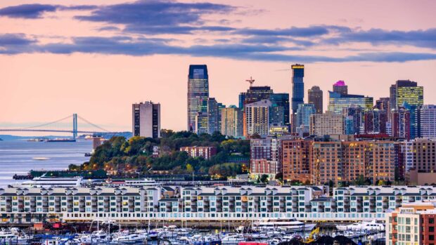Scenic view of New Jersey skyline with buildings and waterfront at sunset