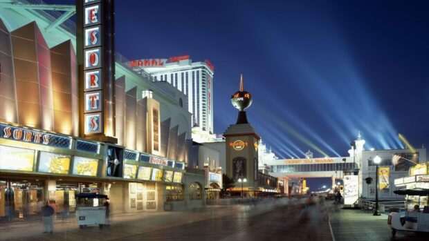 The famous New Jersey boardwalk featuring resorts and the Hard Rock Cafe at night