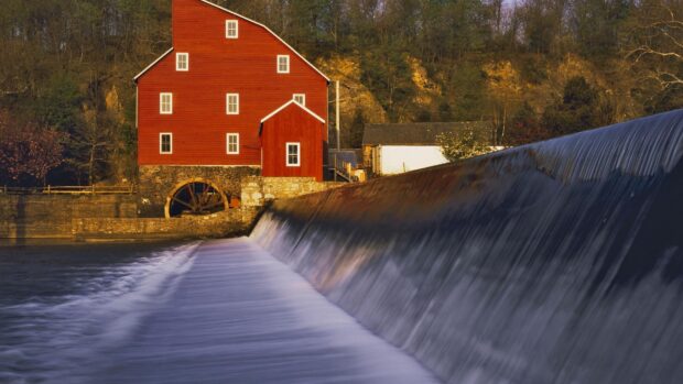 Red mill by the river with flowing water in New Jersey