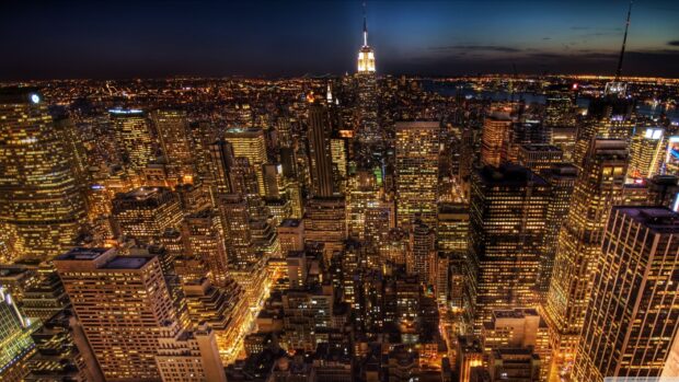 New York city skyline at night filled with illuminated skyscrapers and vibrant lights