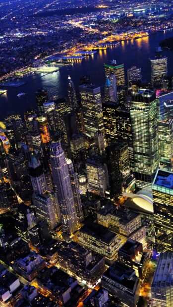 The New York cityscape at night showcasing illuminated skyscrapers and vibrant urban lights