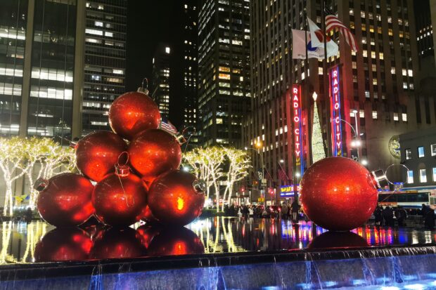 Red Christmas ornaments decoration in New York city during the holiday season at night