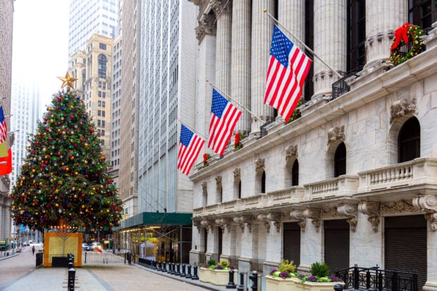 New York Christmas decorated street with a large tree and American flags