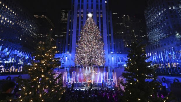New York Christmas tree lighting ceremony at Rockefeller Plaza with festive decorations and crowds